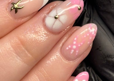 Intricate pink and gold nail art at Nails By Jayden in Glasgow, Scotland, GB showcases exquisite craftsmanship.