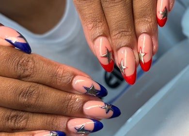 Stylish star-decorated nail art at Nails By Jayden in Glasgow, Scotland, GB.