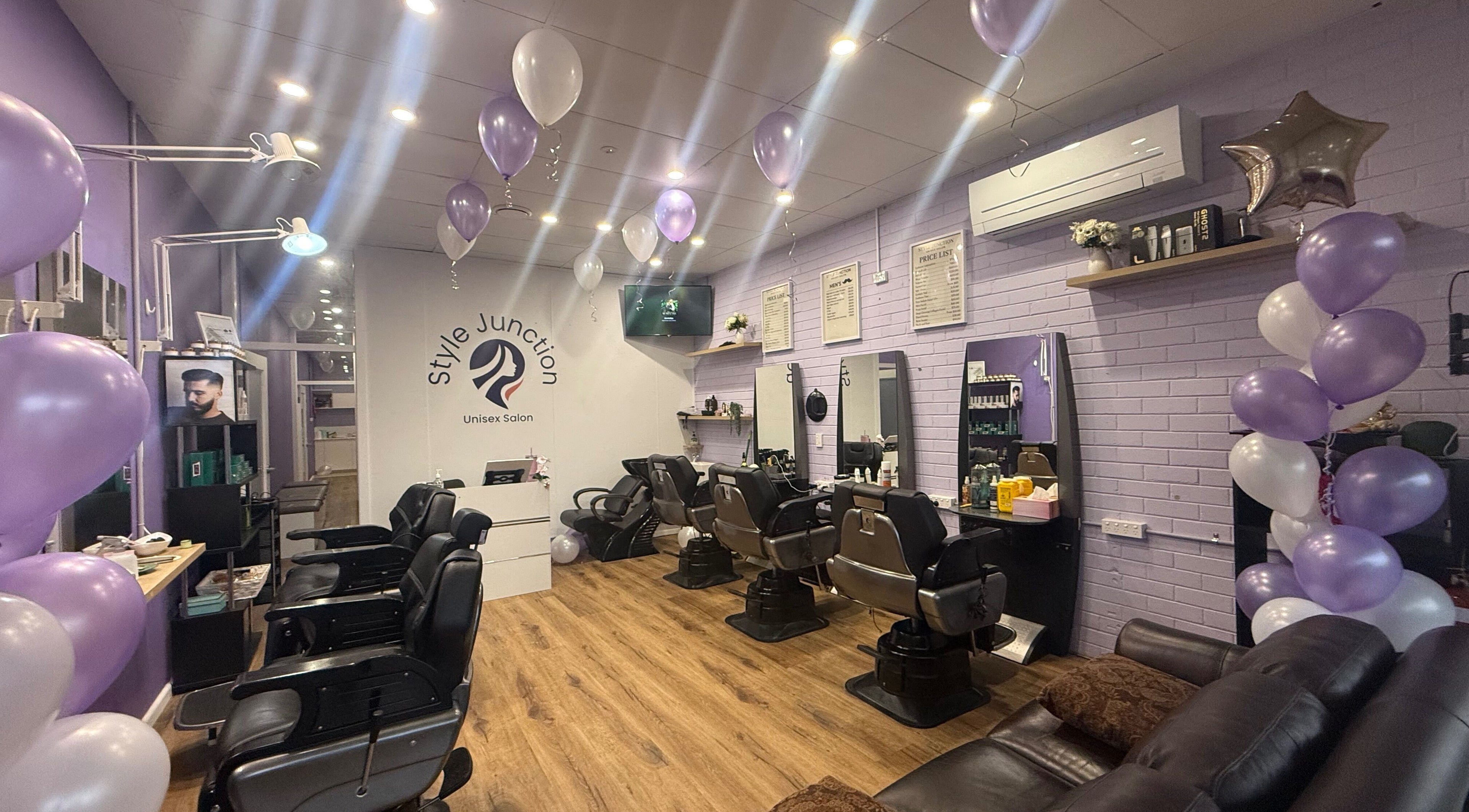 Inside Style Junction Unisex Salon in East Gosford, NSW, featuring chic chairs and purple balloons.