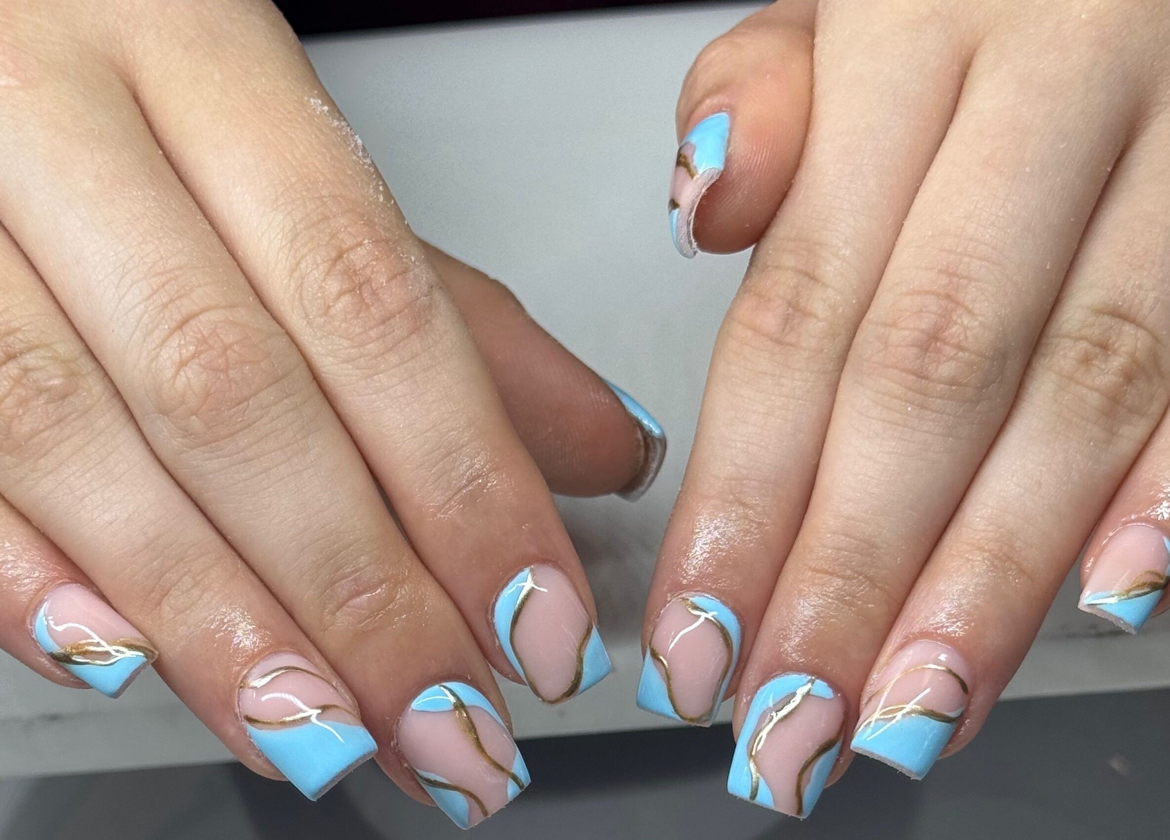Serene blue and gold nail art by NailsbyHollie in Tyldesley, England, GB. Stunning manicure design.