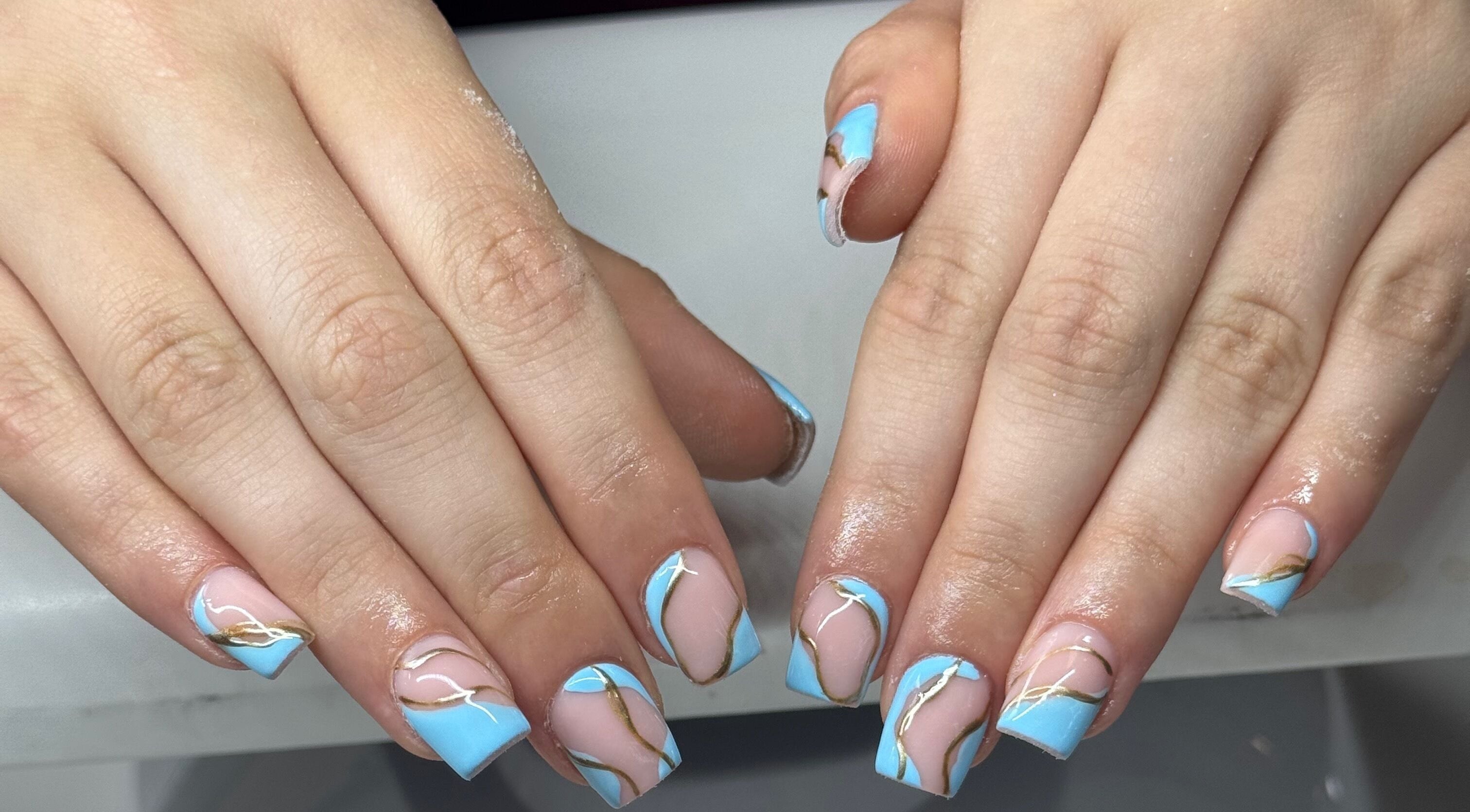 Serene blue and gold nail art by NailsbyHollie in Tyldesley, England, GB. Stunning manicure design.