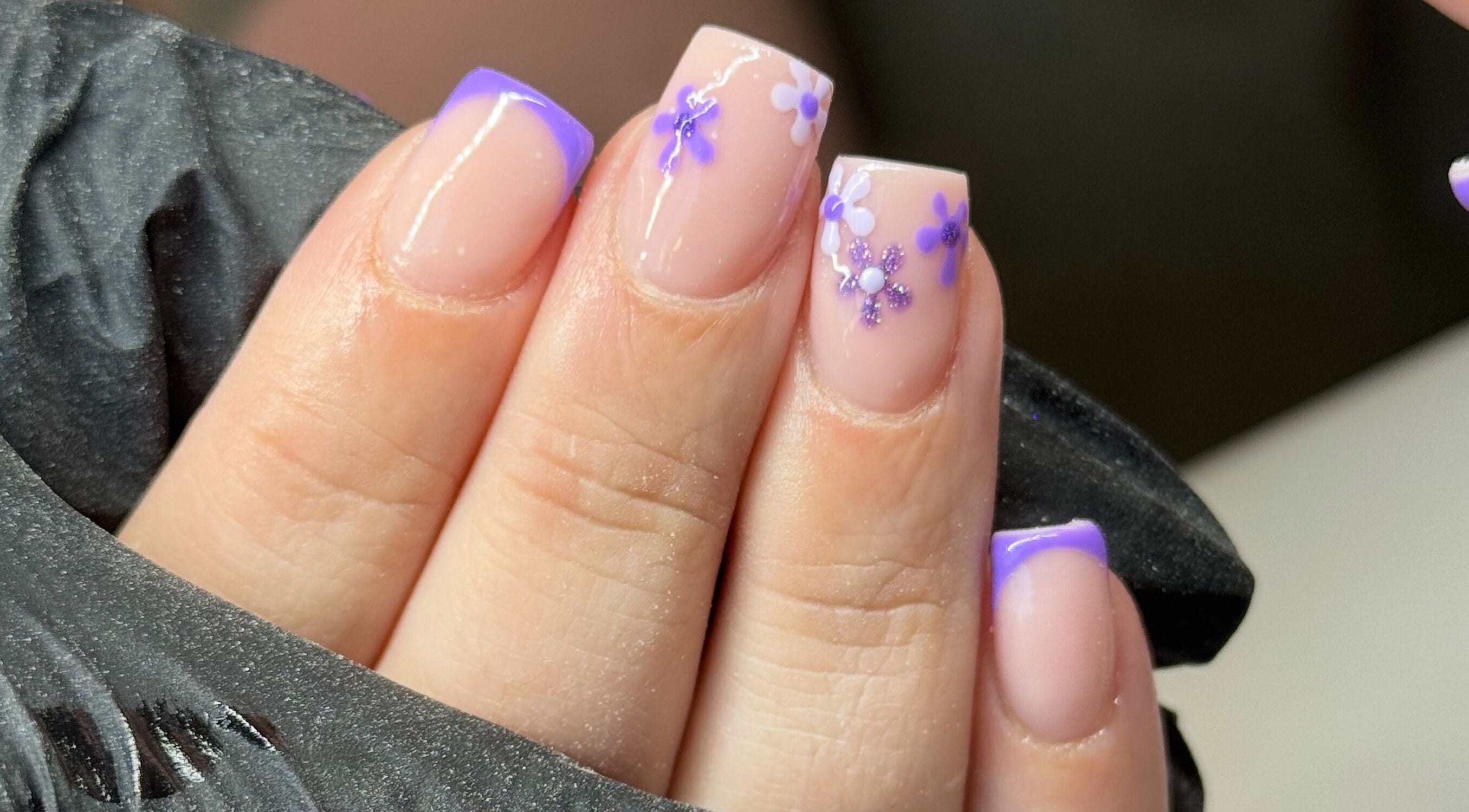 Lavender floral nail art at NailsbyHollie, Tyldesley, England, GB, showcasing intricate flower designs.