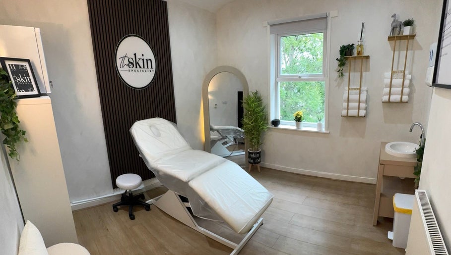 Cozy treatment room at The Skin Specialist UK in Horwich, England, GB with elegant decor and soft lighting.
