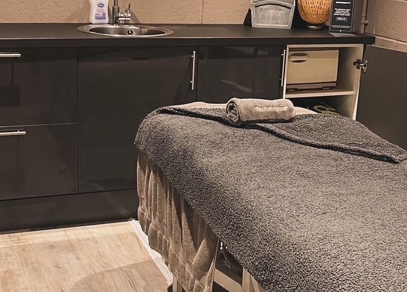 Calming treatment room at Beauty and Holistics by Lucie, Radstock, England, GB, with a plush massage table.