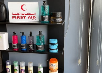 Shelves with hair products at Elite Style, Riyadh, SA, highlighting beauty and wellness selections.
