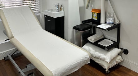 Treatment room at Zita Skin Clinic, Marylebone, England, GB with a comfortable treatment bed and modern amenities.
