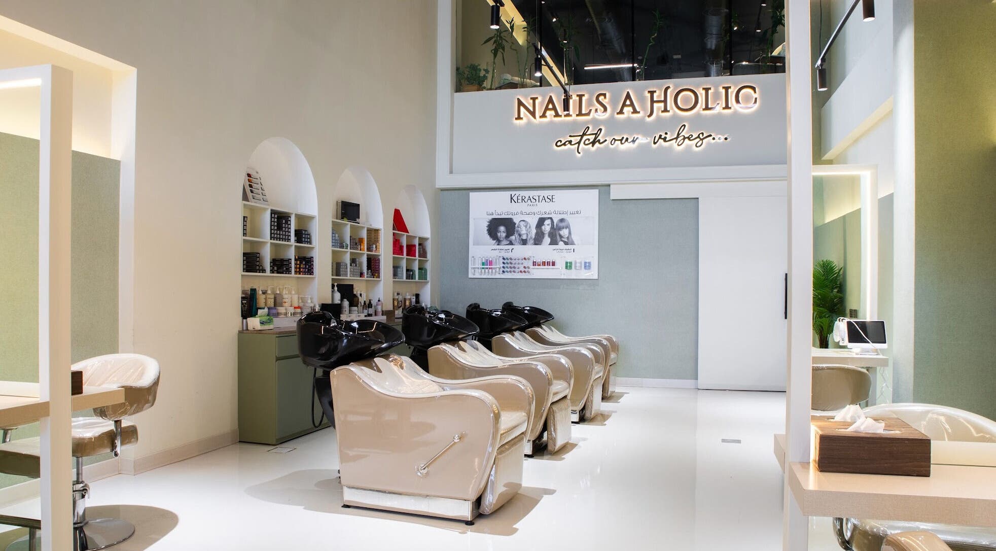 Chic interior of Holic Beauty Lounge - AlWurud Branch in Riyadh, Riyadh Province, SA with salon chairs and styling stations.