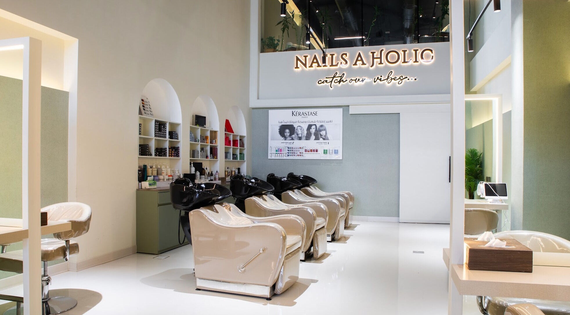 Chic interior of Holic Beauty Lounge - AlWurud Branch in Riyadh, Riyadh Province, SA with salon chairs and styling stations.