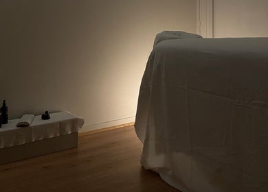 Relaxing massage room at Shkurka — Massage Studio in Byron Bay, NSW, AU, featuring a dimly lit ambiance.