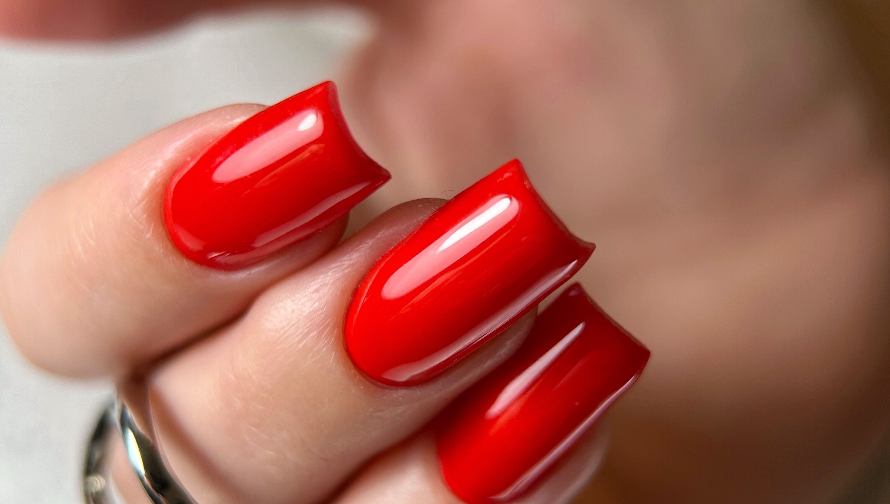 Vibrant red nails showcased at Dangina Studio, Aurora, Illinois, US. Perfect nail art.
