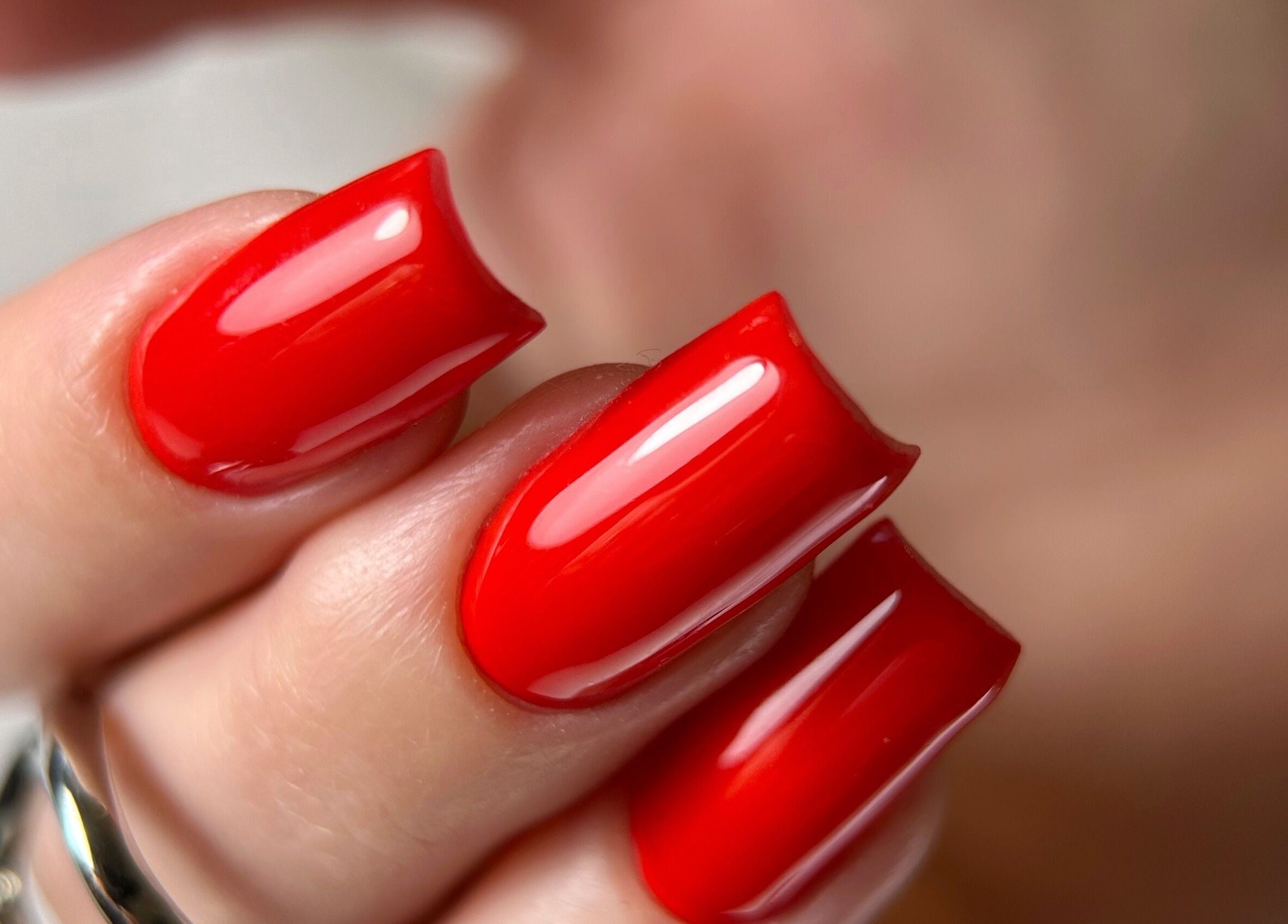Vibrant red nails showcased at Dangina Studio, Aurora, Illinois, US. Perfect nail art.