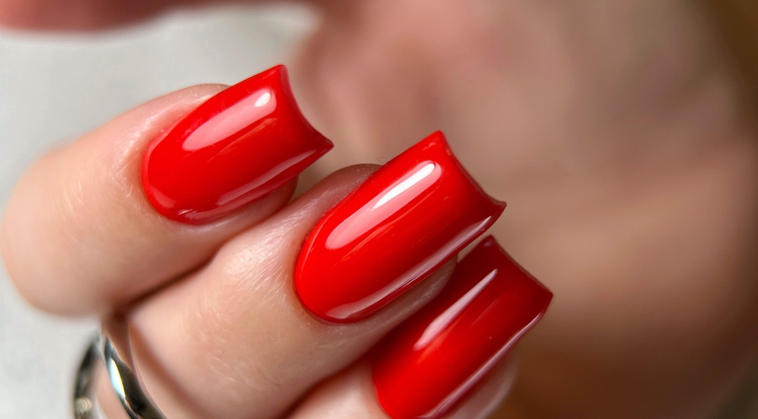 Vibrant red nails showcased at Dangina Studio, Aurora, Illinois, US. Perfect nail art.