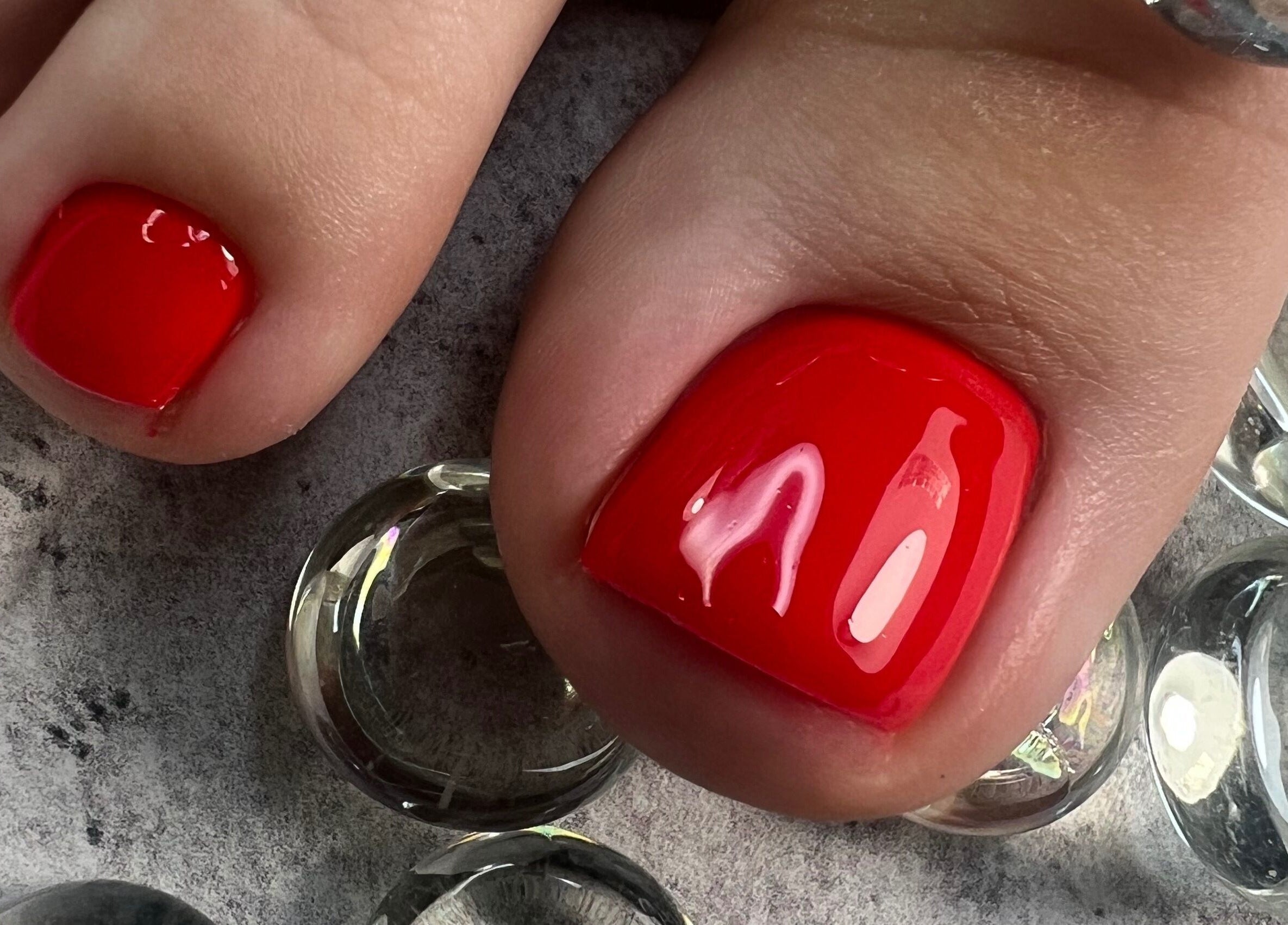 Bright red pedicure at Dangina Studio, Aurora, Illinois, US. Perfect for vibrant, stylish nails.