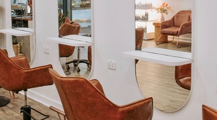 Stylish salon interior at Miss June Greenwith in Greenwith, South Australia, AU, with modern chairs and mirrors.