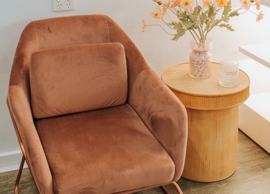 Comfortable brown chair and side table at Miss June Greenwith, Greenwith, South Australia, AU.
