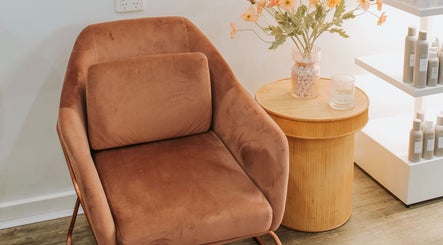 Comfortable brown chair and side table at Miss June Greenwith, Greenwith, South Australia, AU.