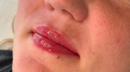 Close-up of glossy lips at Amber Rose Cosmetics x in Walsall, England, GB.