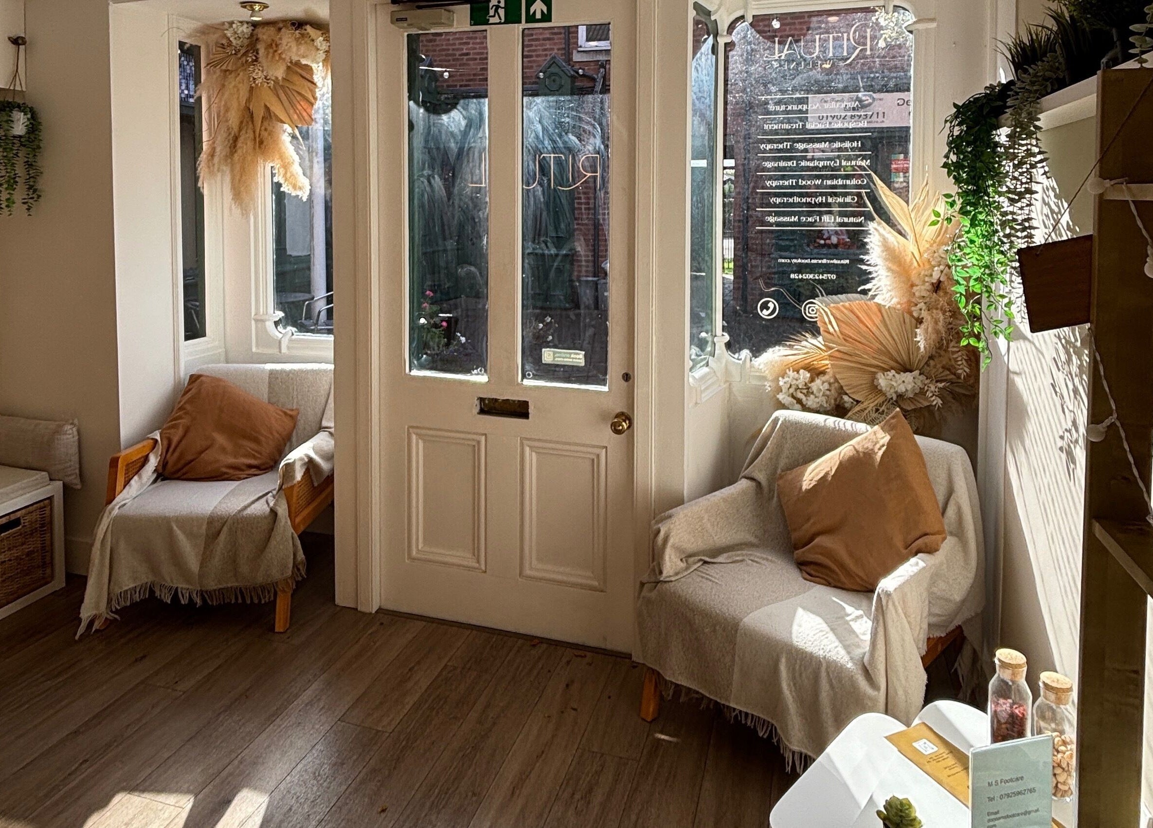 Amber Rose Cosmetics cozy entrance lounge in Wombourne, England, GB with warm decor and natural light.