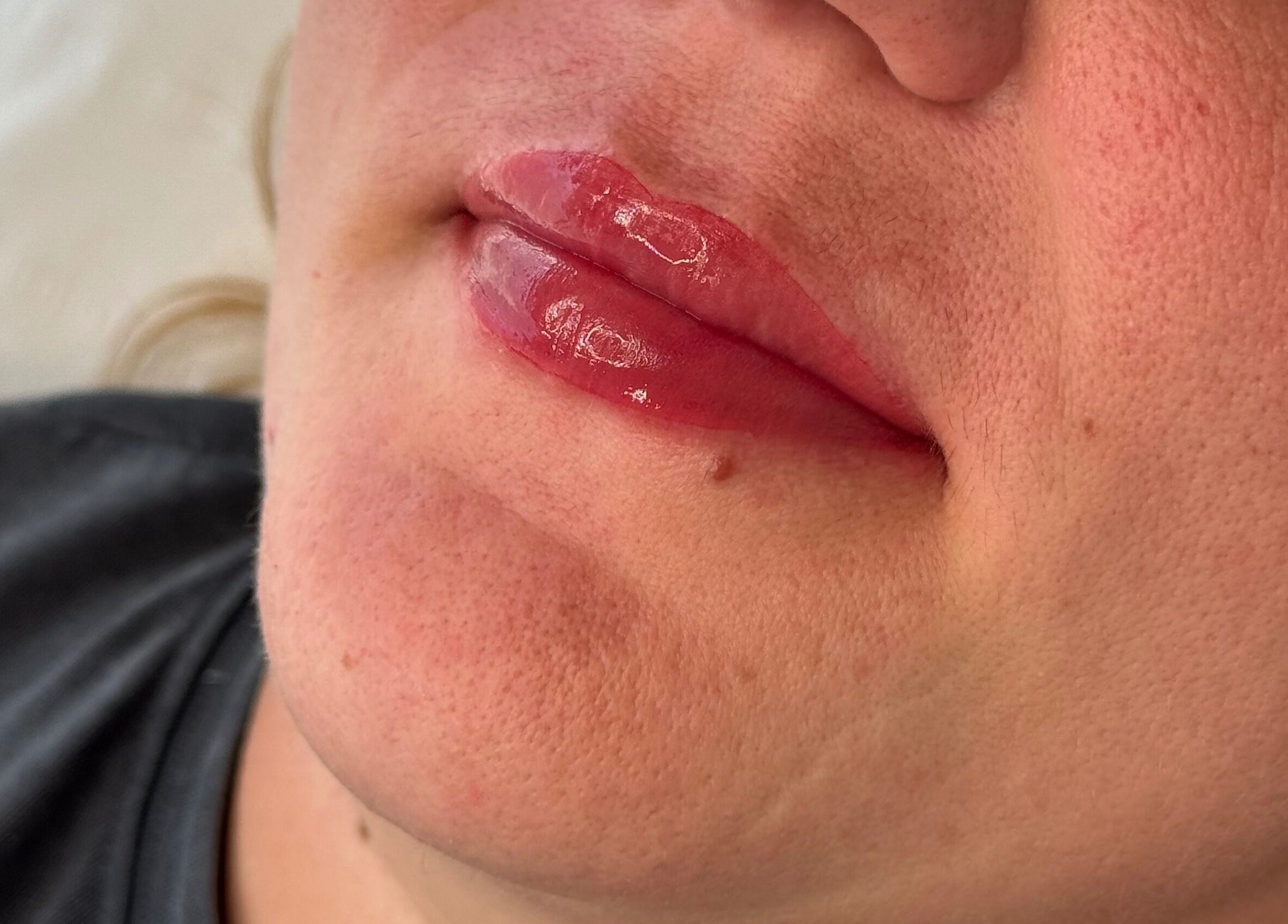 Close-up of glossy lips after treatment at Amber Rose Cosmetics in Wombourne, England, GB.