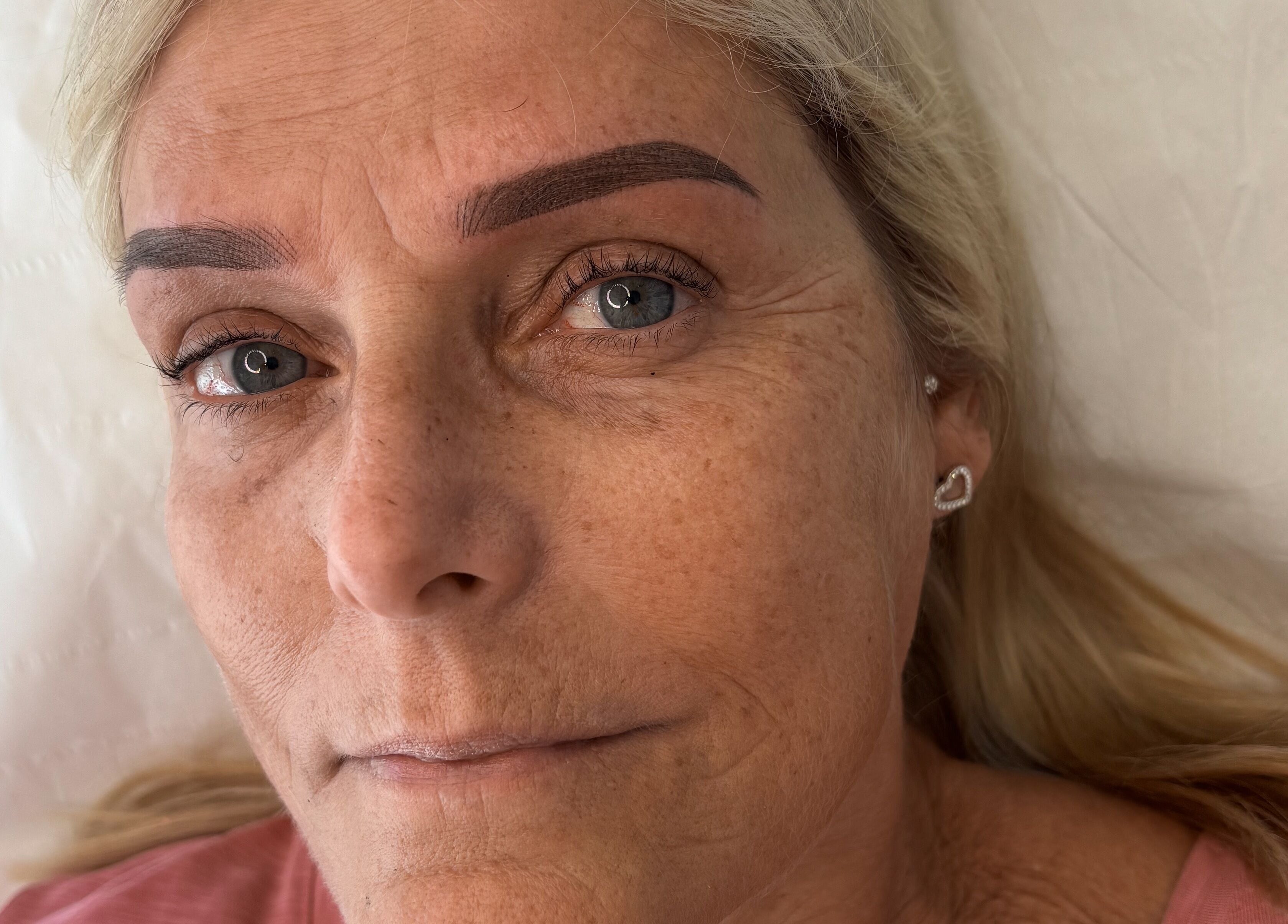 Close-up of a woman's elegantly styled eyebrows at Amber Rose Cosmetics, Wombourne, England, GB.