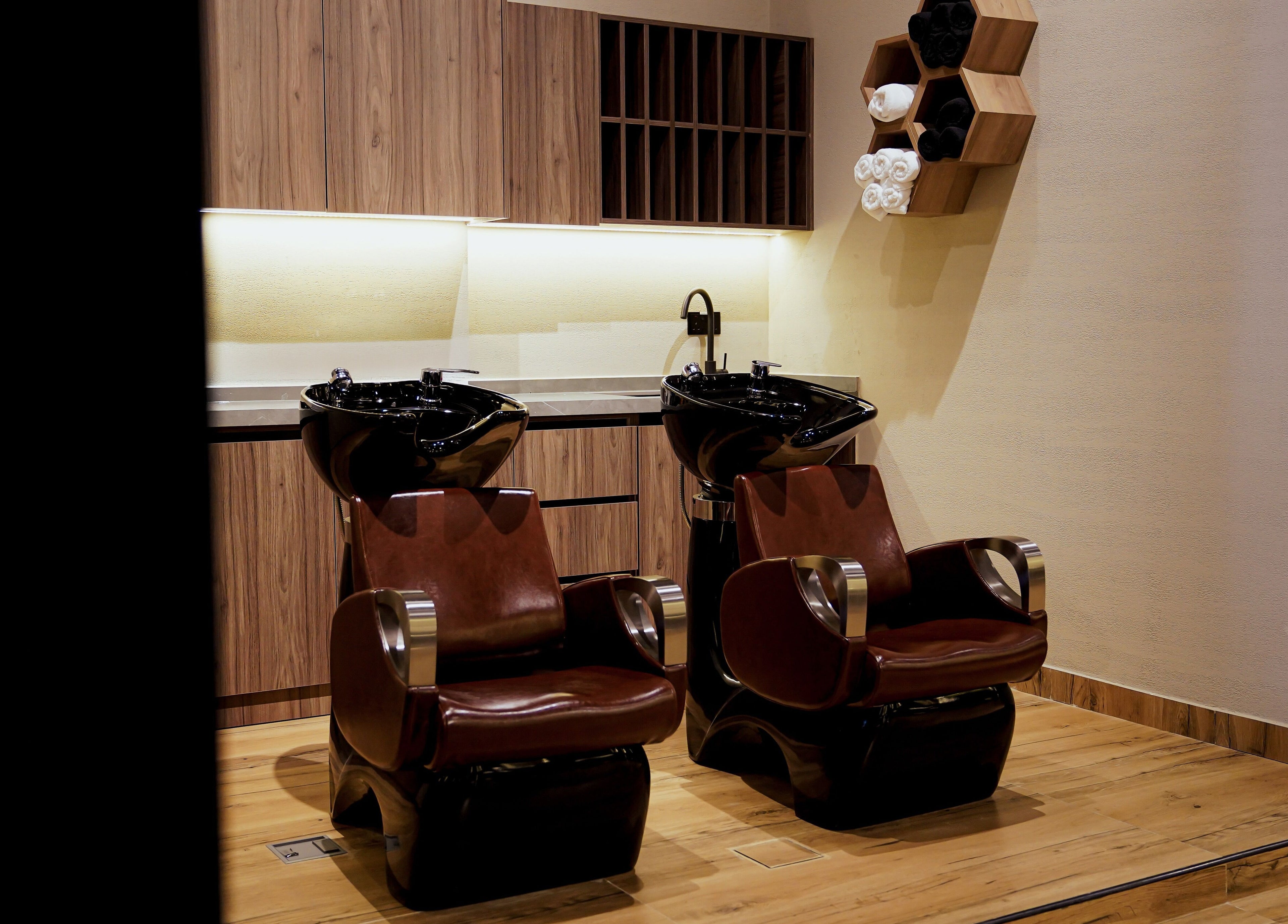 Modern wash stations at Trim and Latte Men Hairdressing Trimming and Styling, Abu Dhabi, Abu Dhabi, AE.