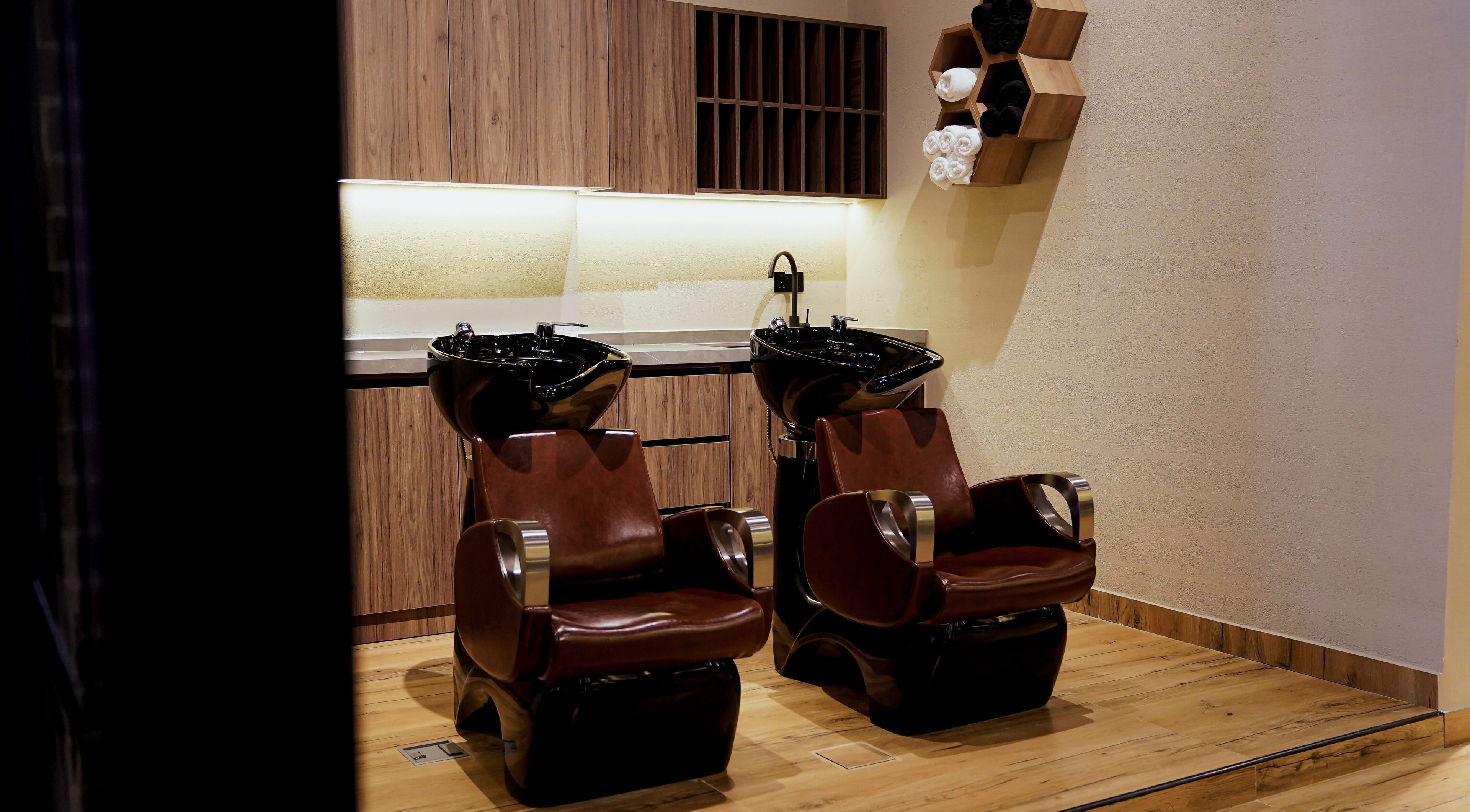 Modern wash stations at Trim and Latte Men Hairdressing Trimming and Styling, Abu Dhabi, Abu Dhabi, AE.