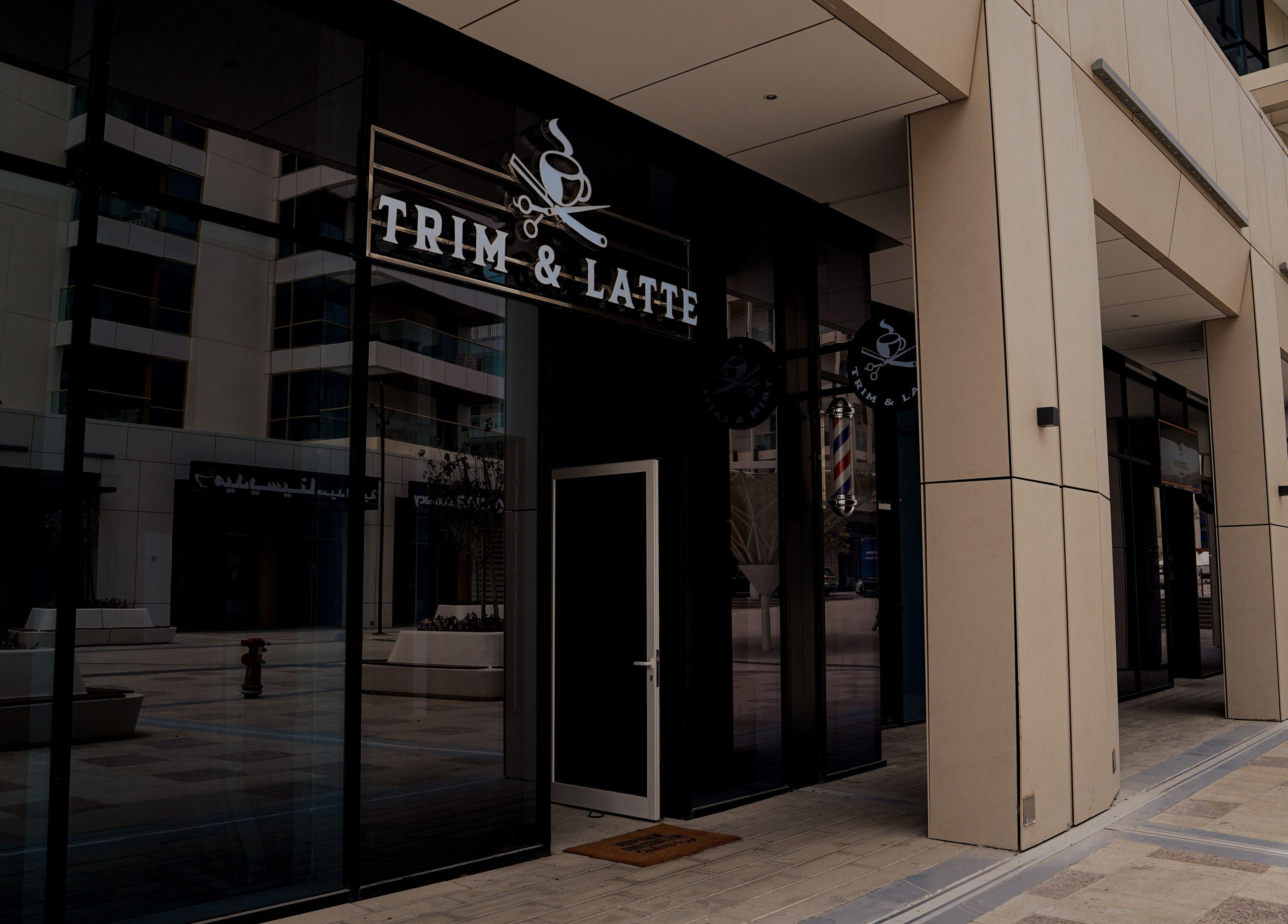 Entrance of Trim and Latte Men Hairdressing Trimming and Styling in Abu Dhabi, AE, featuring sleek design.