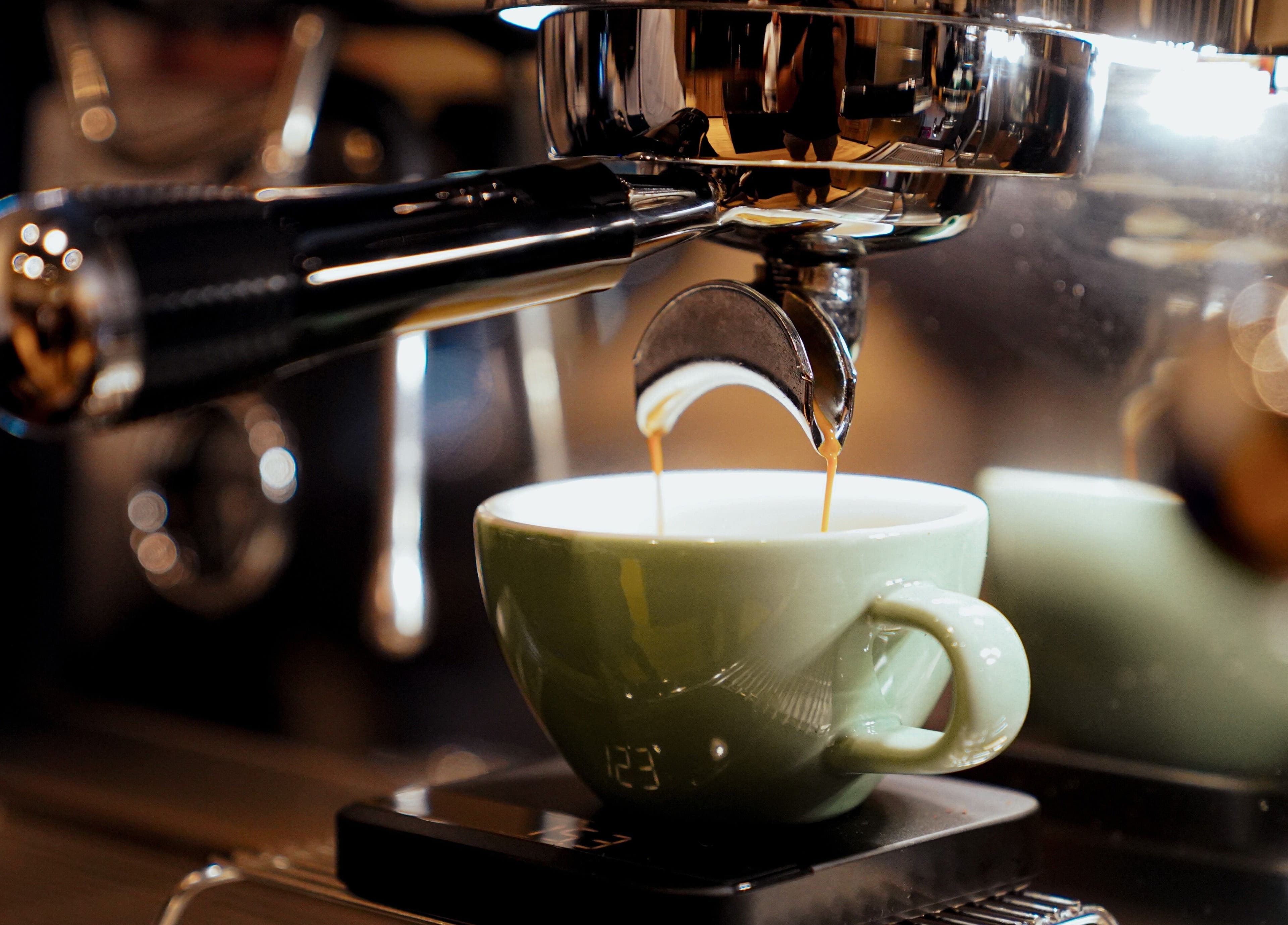 Rich espresso being prepared at Trim and Latte Men Hairdressing Trimming and Styling, Abu Dhabi, AE.