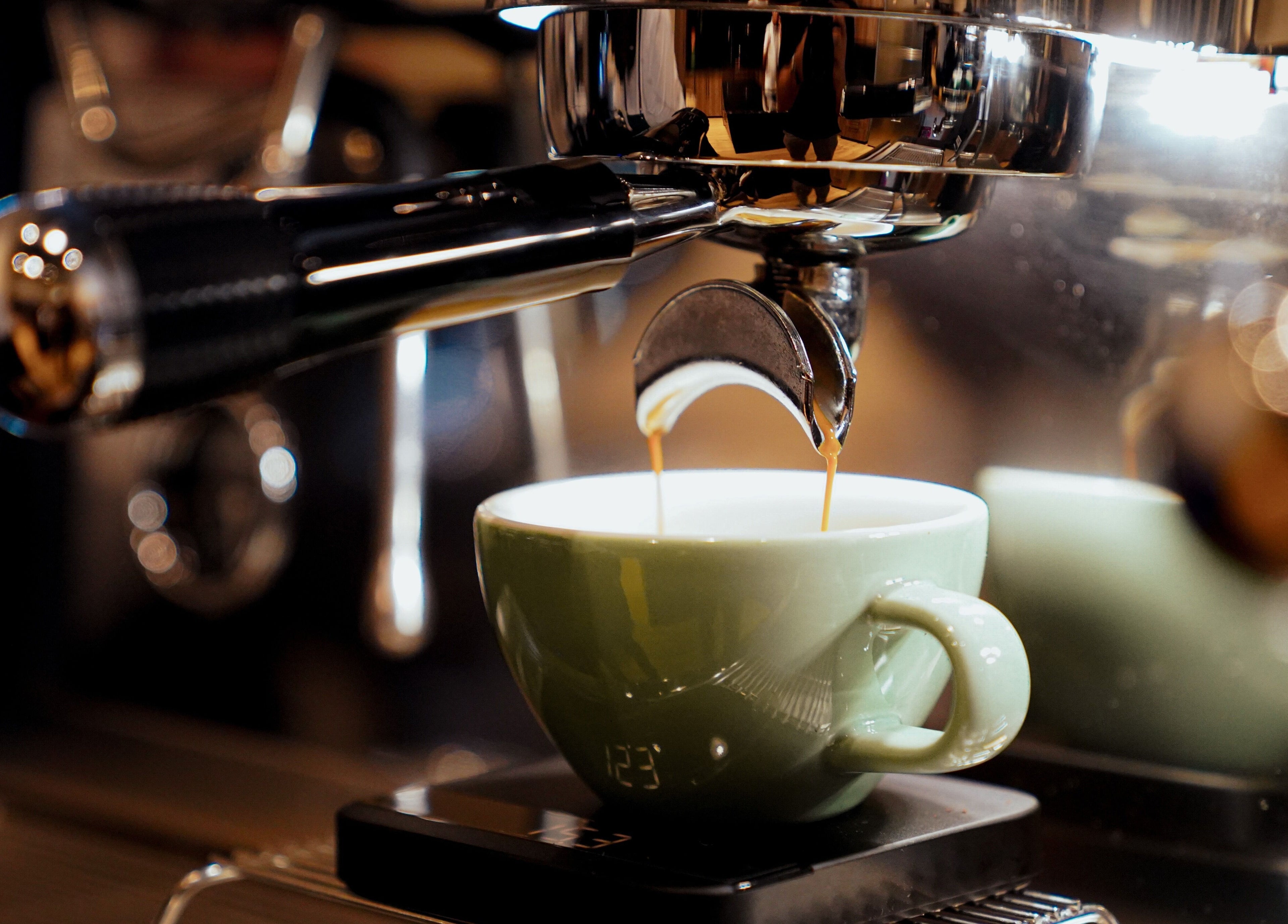 Rich espresso being prepared at Trim and Latte Men Hairdressing Trimming and Styling, Abu Dhabi, AE.