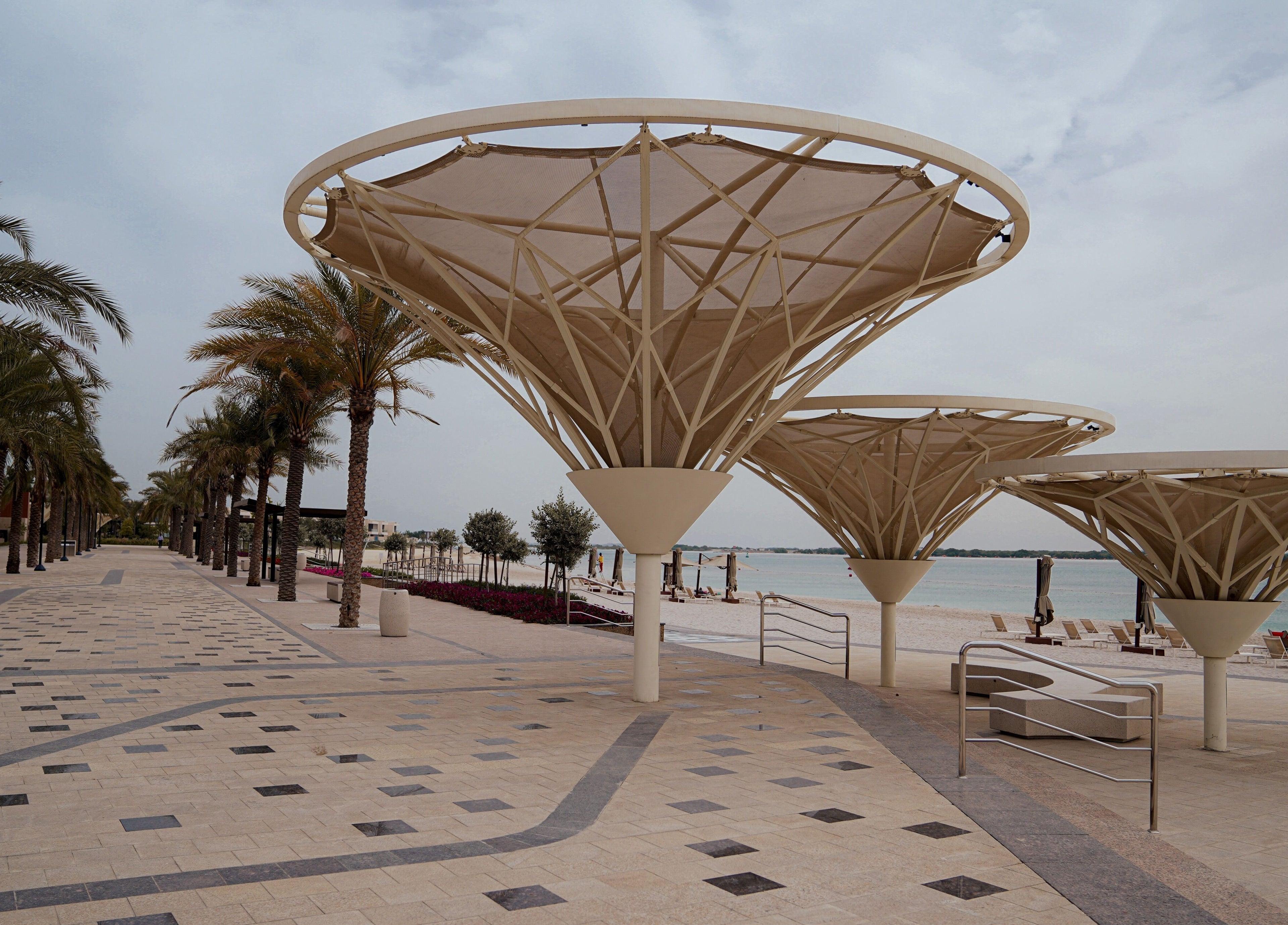 Stylish beachfront umbrellas near Trim and Latte Men Hairdressing Trimming and Styling, Abu Dhabi, AE.