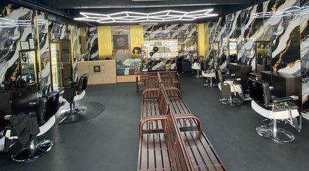 Modern interior of Mco Barbershop D'anjung in Shah Alam, Selangor, MY with sleek barber chairs and unique wall designs.
