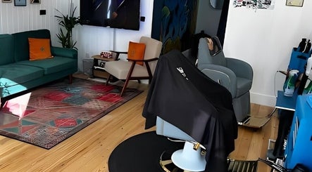 Contemporary lounge area at Spendlow's Barbering, Newark-on-trent, England, GB. Cozy seating with stylish decor.