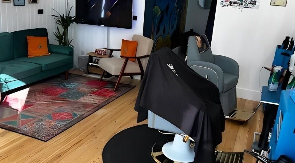 Contemporary lounge area at Spendlow's Barbering, Newark-on-trent, England, GB. Cozy seating with stylish decor.