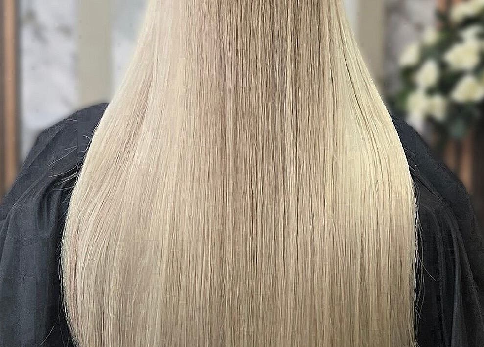 Long, straight blonde hair at Deluxe Aurora Hair Extensions, Stoke-on-Trent, England, GB showcasing elegance.
