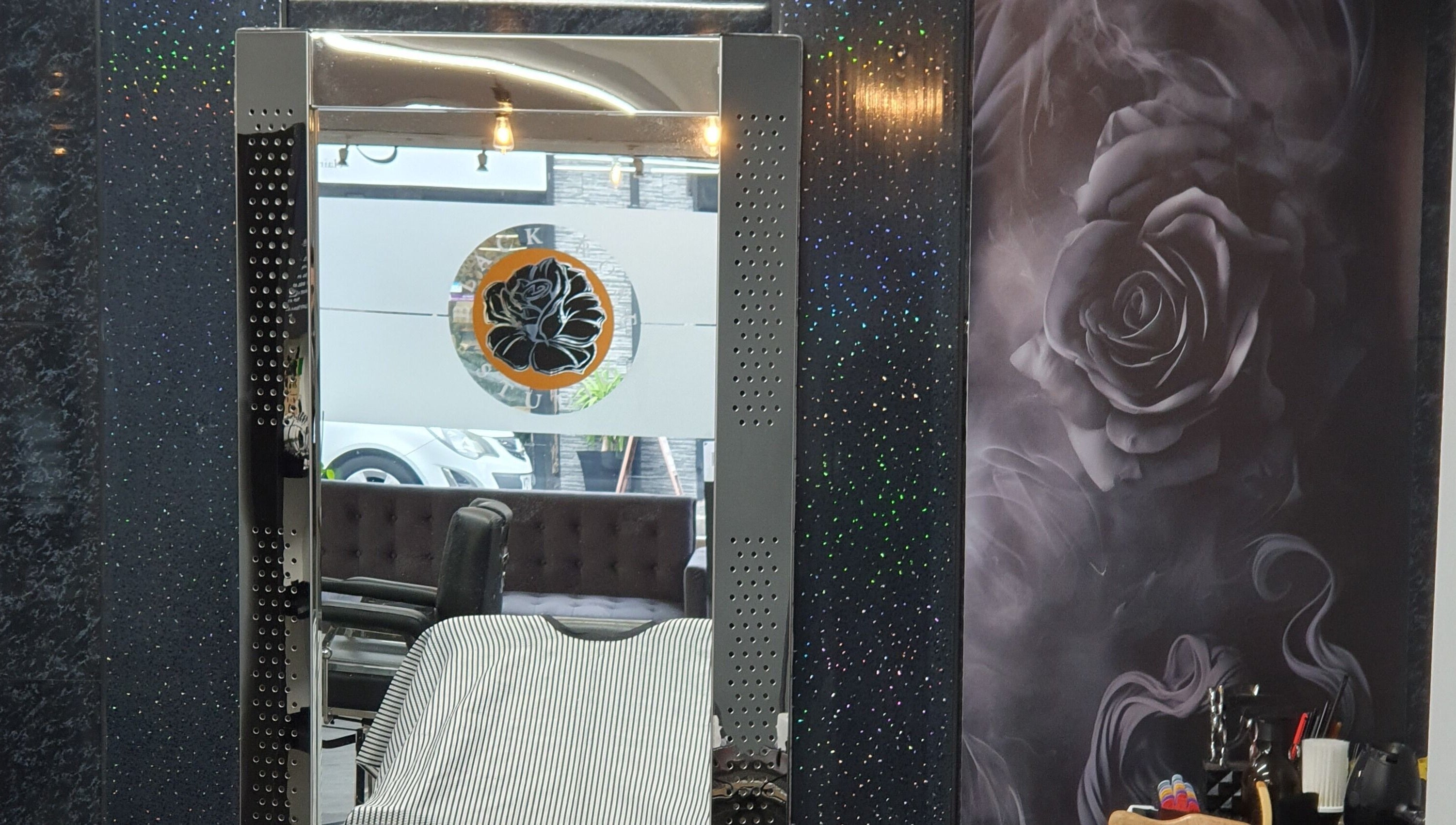 Stylish barber chair and mirror at Hard Knoxx Barbers, Barrow-in-Furness, England, GB.