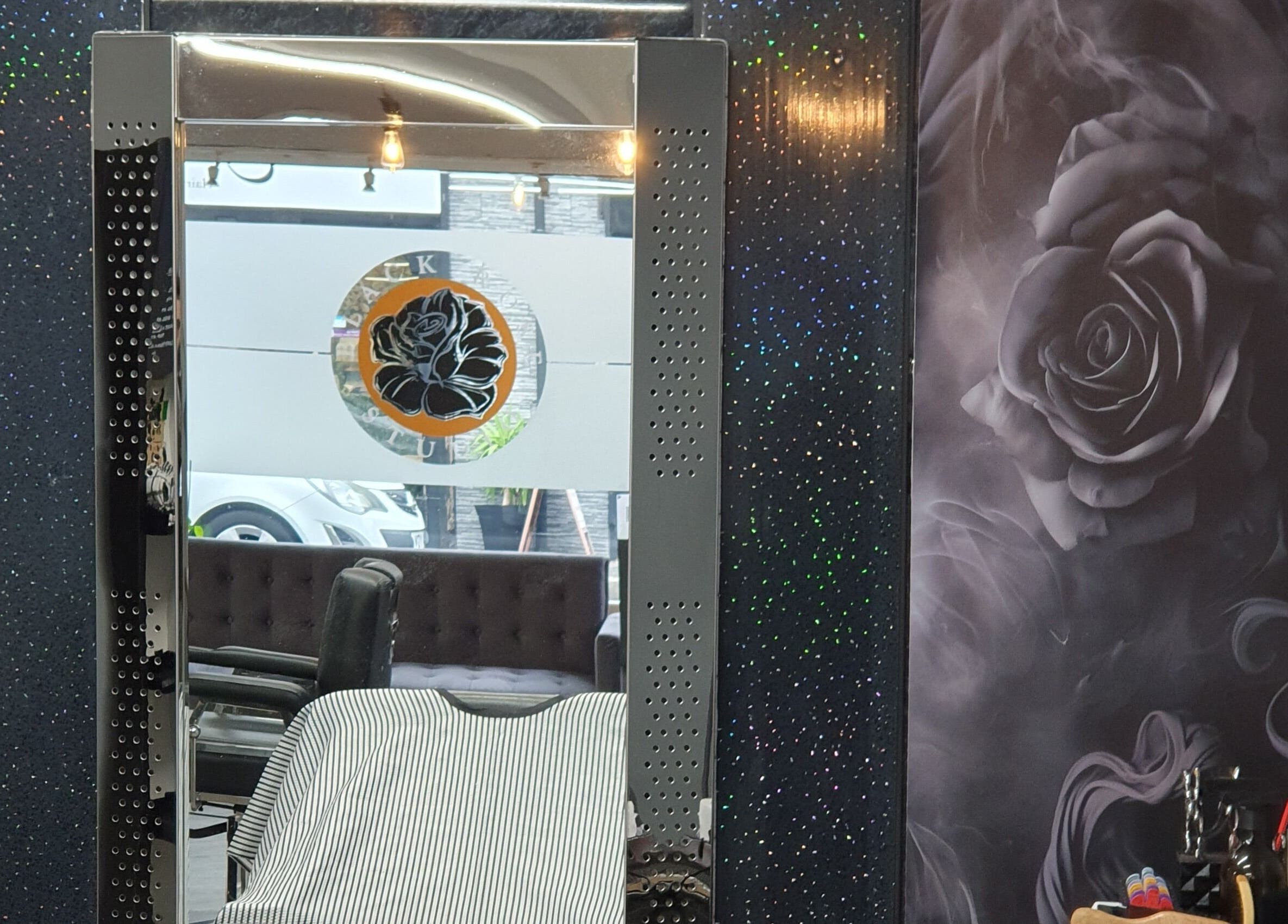 Stylish barber chair and mirror at Hard Knoxx Barbers, Barrow-in-Furness, England, GB.