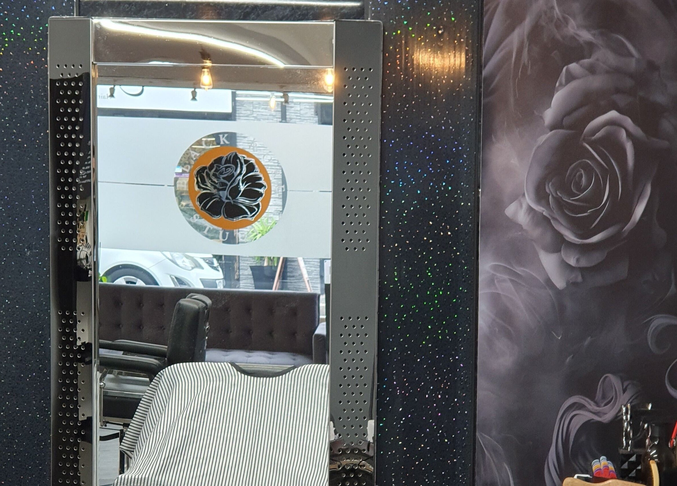 Stylish barber chair and mirror at Hard Knoxx Barbers, Barrow-in-Furness, England, GB.