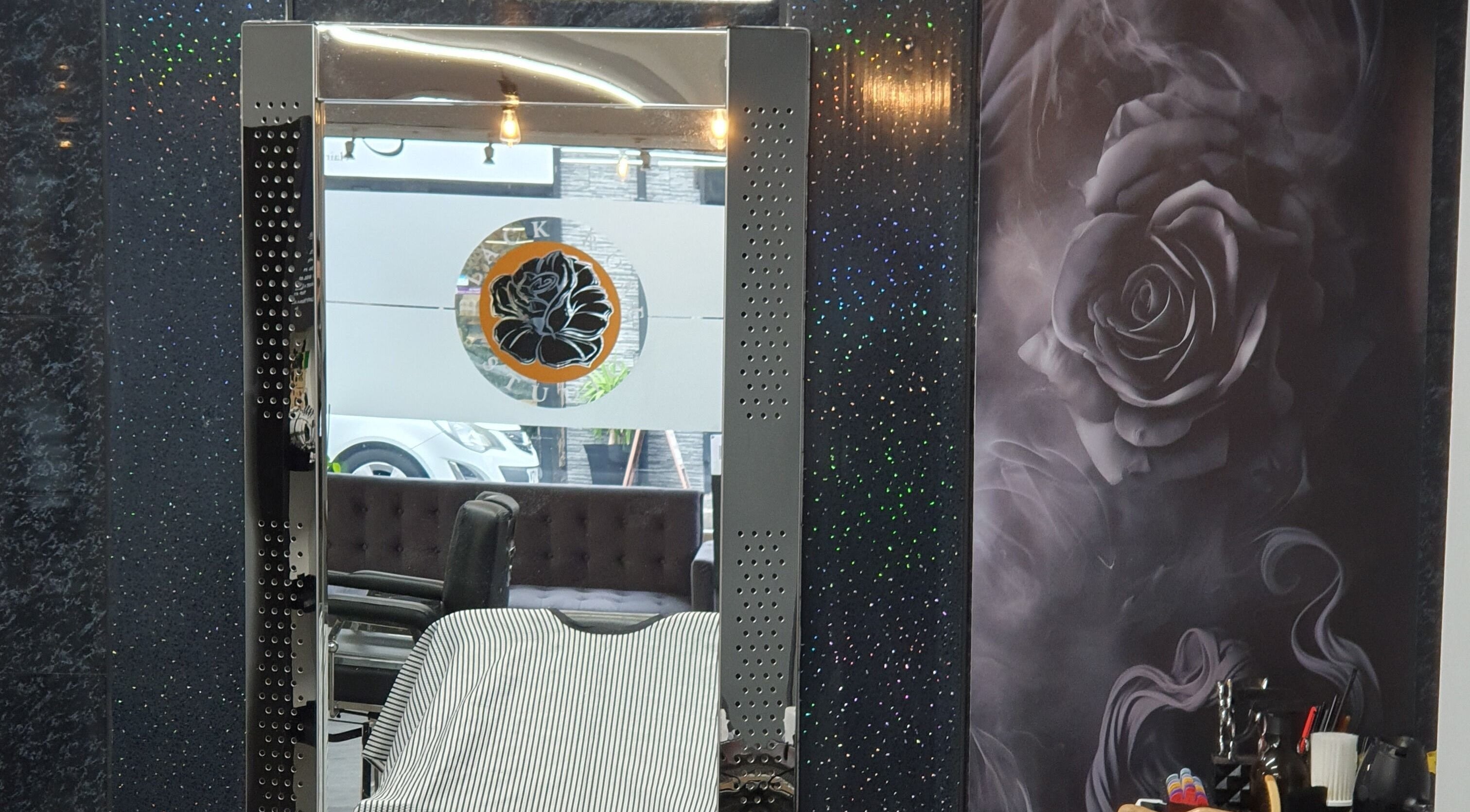 Stylish barber chair and mirror at Hard Knoxx Barbers, Barrow-in-Furness, England, GB.