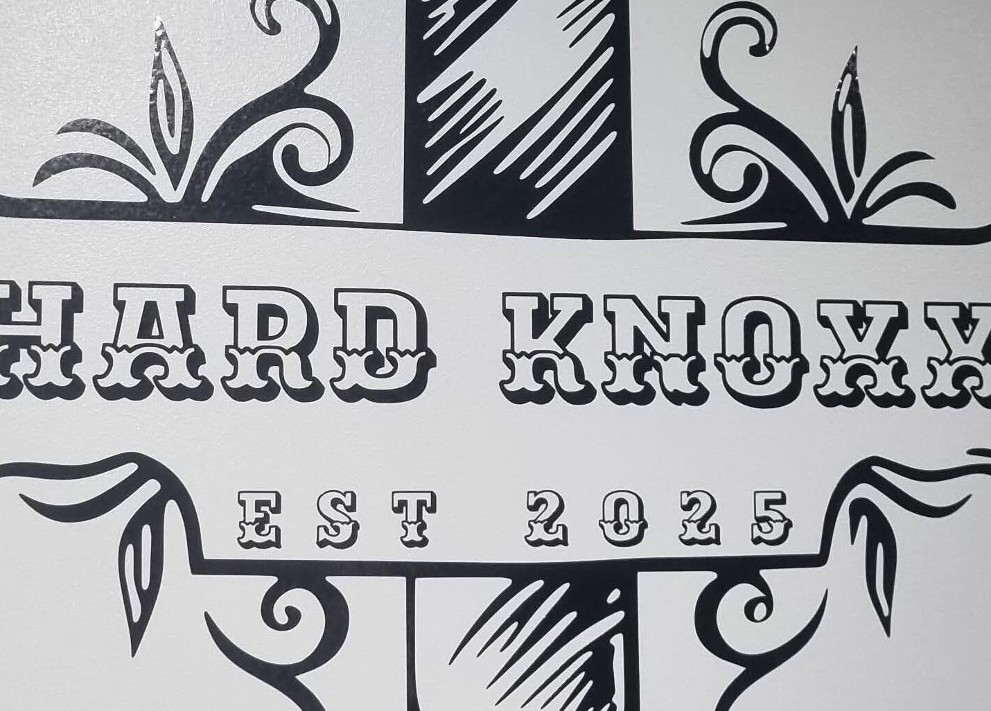 Elegant logo of Hard Knoxx Barbers, Barrow-in-Furness, England, GB, featuring ornate design elements.