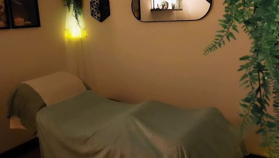 Relaxing massage room at Tranquility Well-Being, Cromer, England. Soft lighting and calming decor.