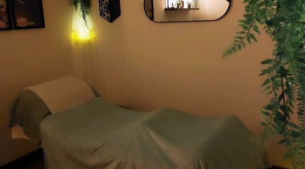 Relaxing massage room at Tranquility Well-Being, Cromer, England. Soft lighting and calming decor.