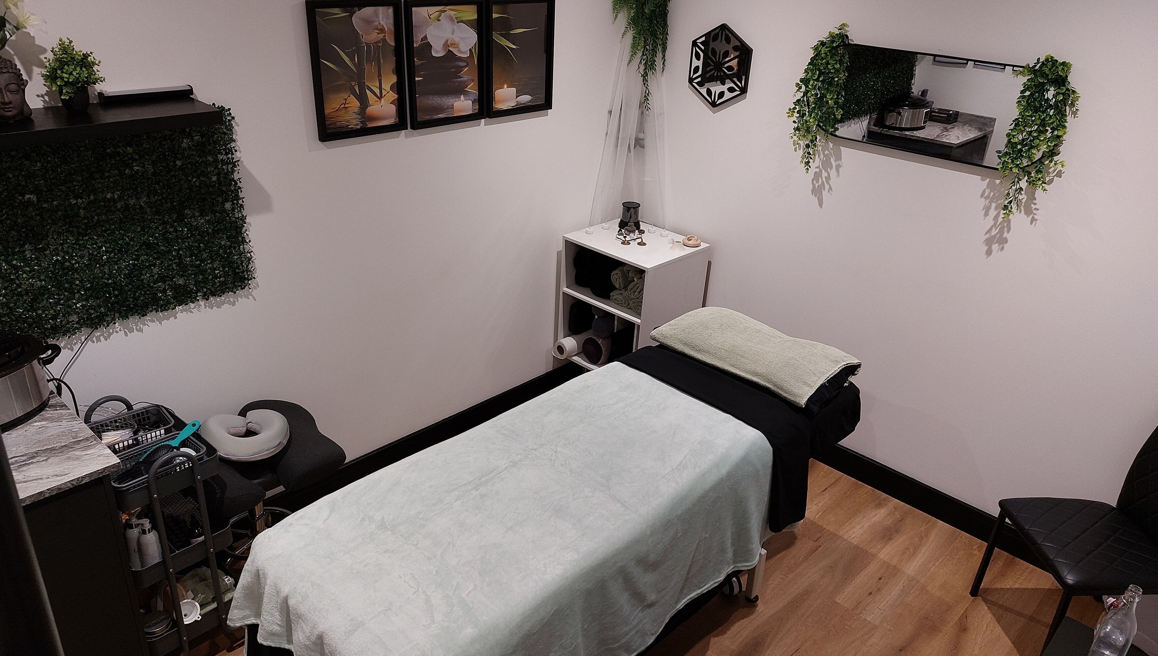 Serene massage room at Tranquility Well-Being, Cromer, England, GB featuring calm decor and soft lighting.