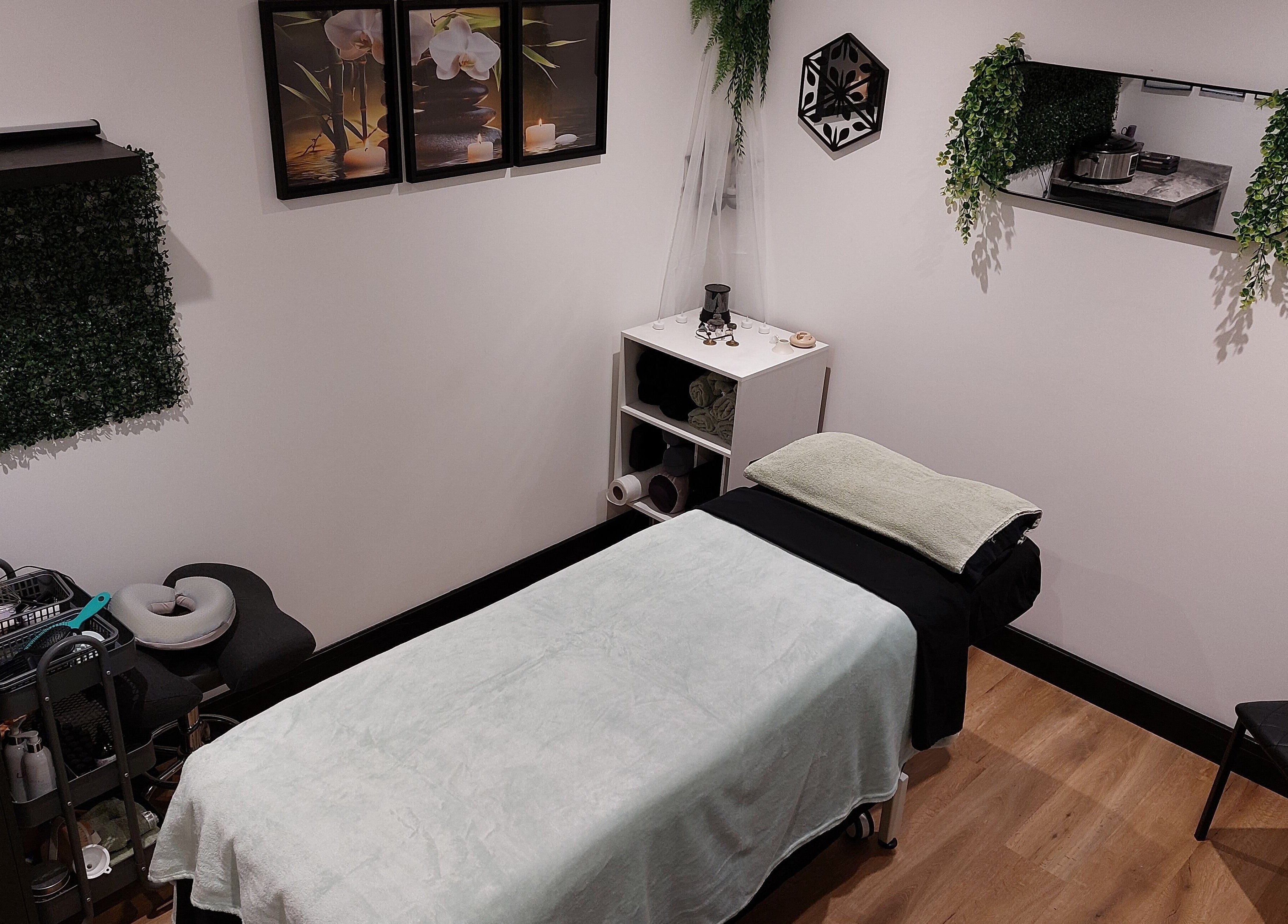 Serene massage room at Tranquility Well-Being, Cromer, England, GB featuring calm decor and soft lighting.