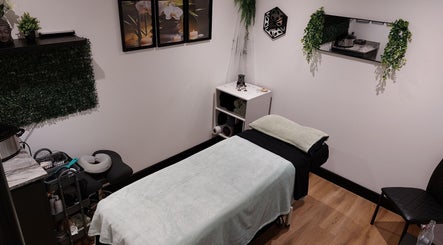 Serene massage room at Tranquility Well-Being, Cromer, England, GB featuring calm decor and soft lighting.