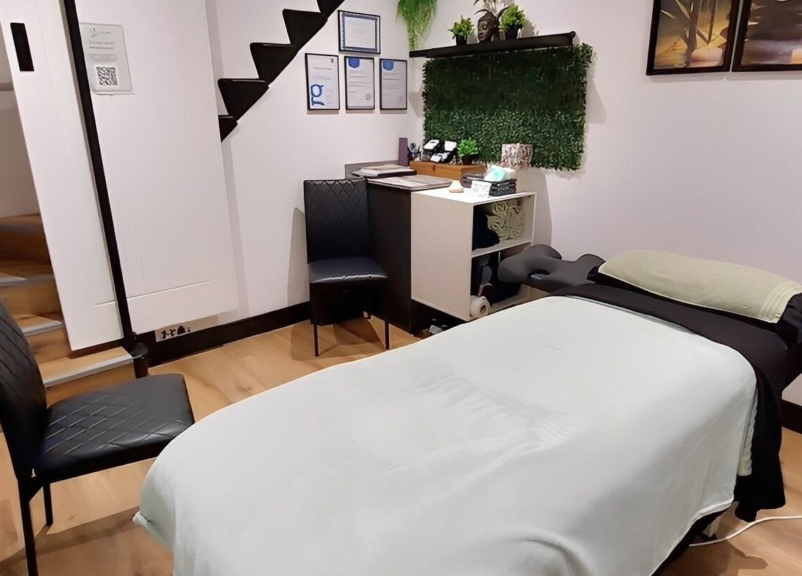 Tranquility Well-Being spa room with massage table in Cromer, England, GB.