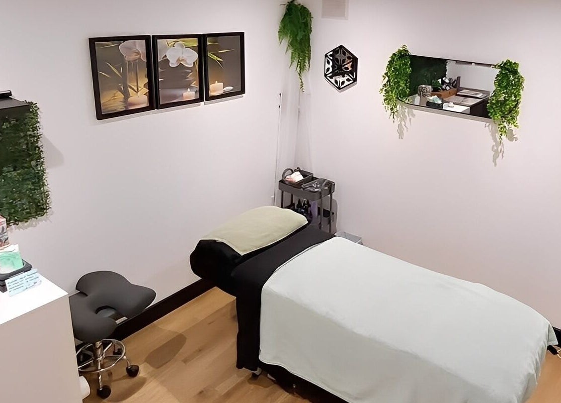 Relaxing massage room at Tranquility Well-Being, Cromer, England, GB, featuring calming decor and a cozy bed.