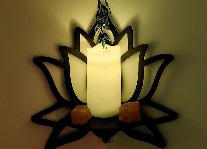 Candlelight lotus decor at Tranquility Well-Being, Cromer, England, GB creates a calming ambiance.