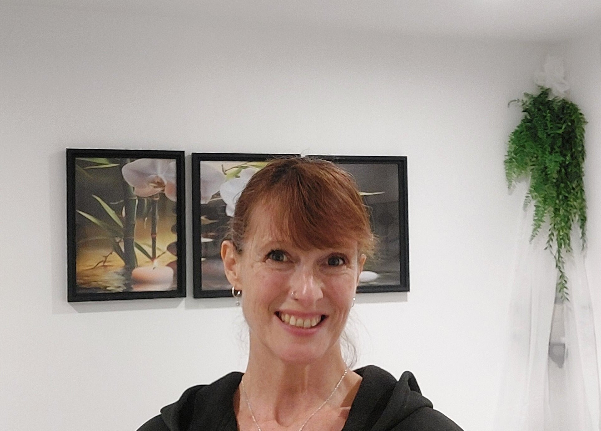 Relaxing interior of Tranquility Well-Being, Cromer, England, GB, with peaceful artwork and greenery.