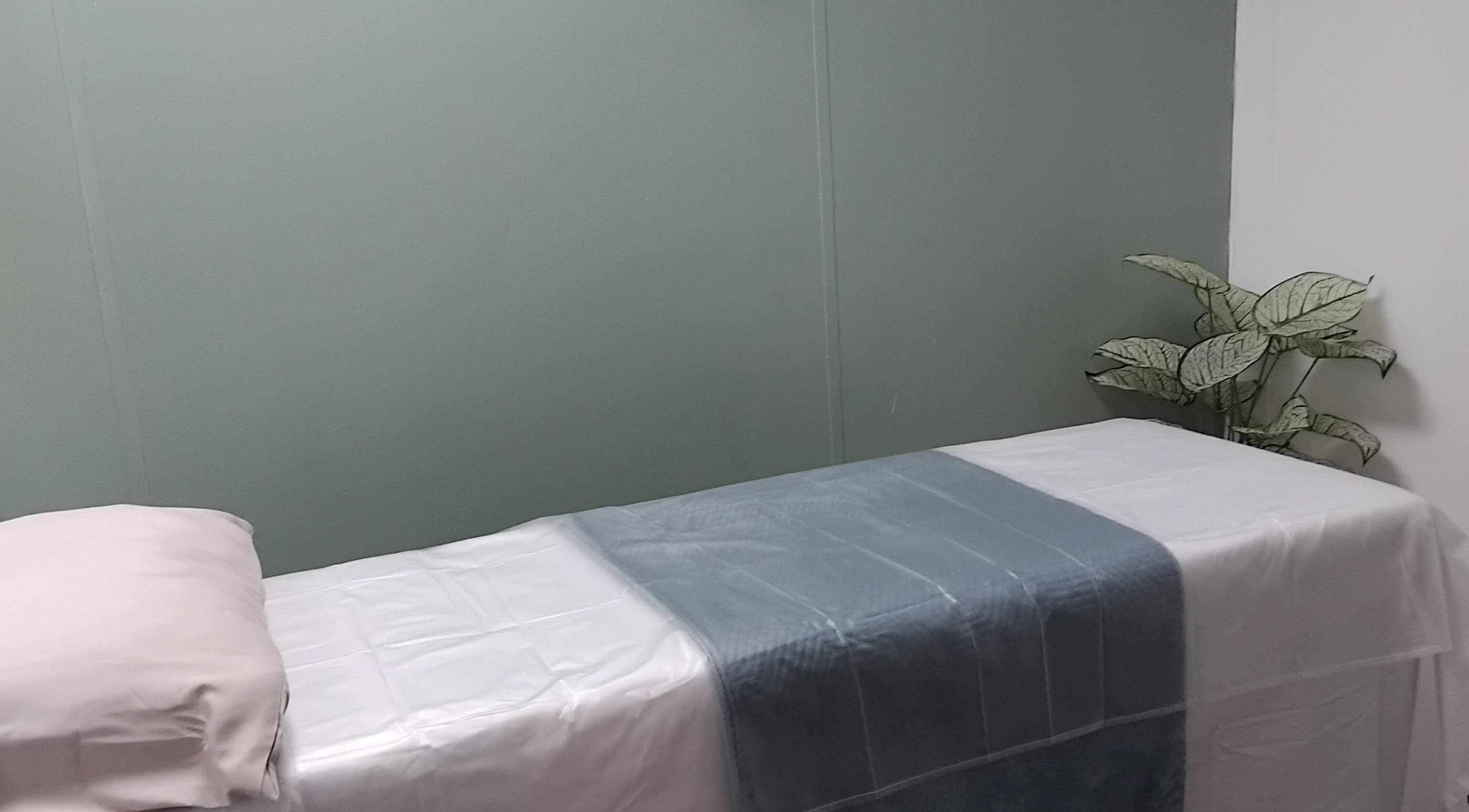 Relaxing massage bed at The Breeze Wax Studio, Johannesburg, Gauteng, ZA with calming decor.