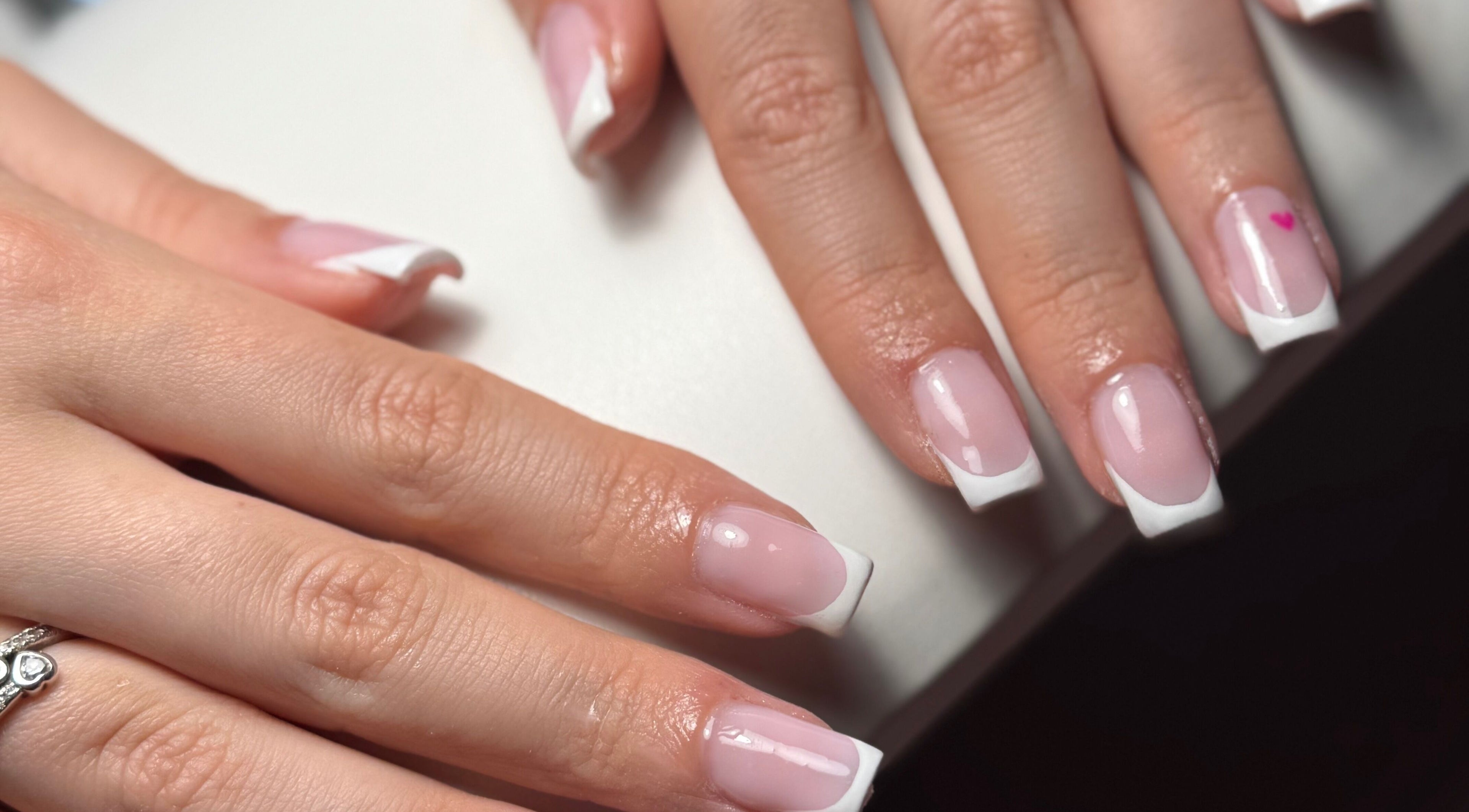Elegant French manicure at By Ella Jade, Hemel Hempstead, England, GB, showcasing a pink and white nail design.